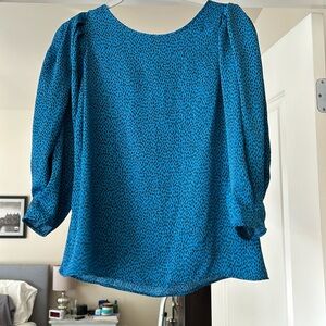 Pretty lightweight and flowy blouse- never worn